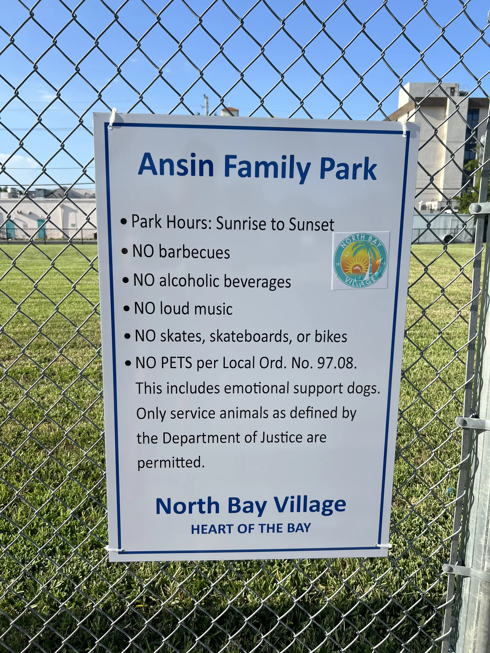 Ansin Family Park sign showing sunrise-to-sunset hours and visitor rules, transcribed above