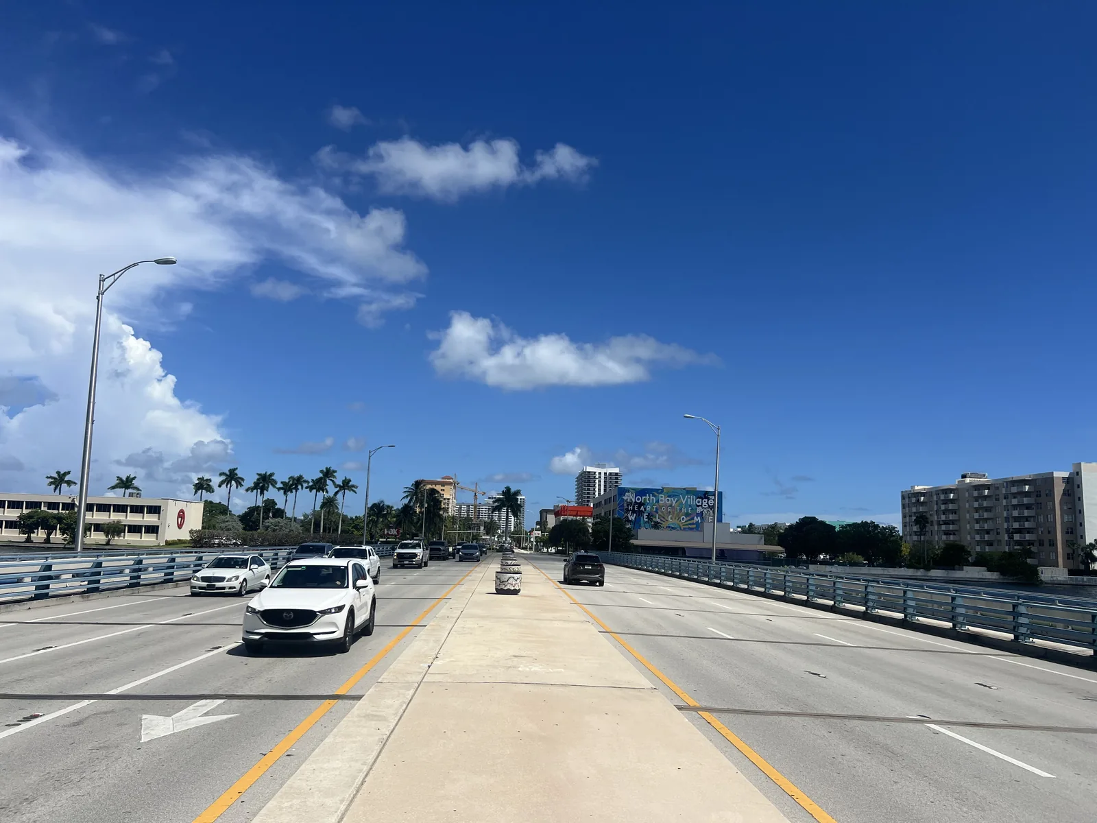 The bridge sidewalk and roadway connect the island walk with the rest of North Bay Village.