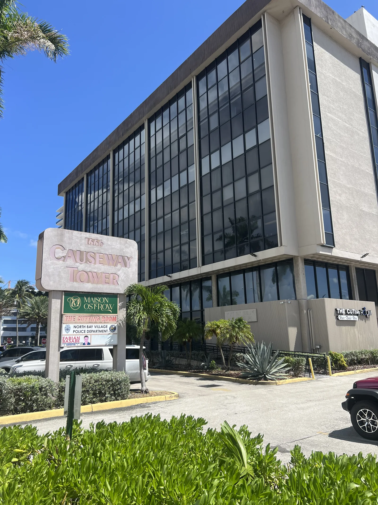 The Causeway Towers roadside sign and building, seen during the neighborhood walk.