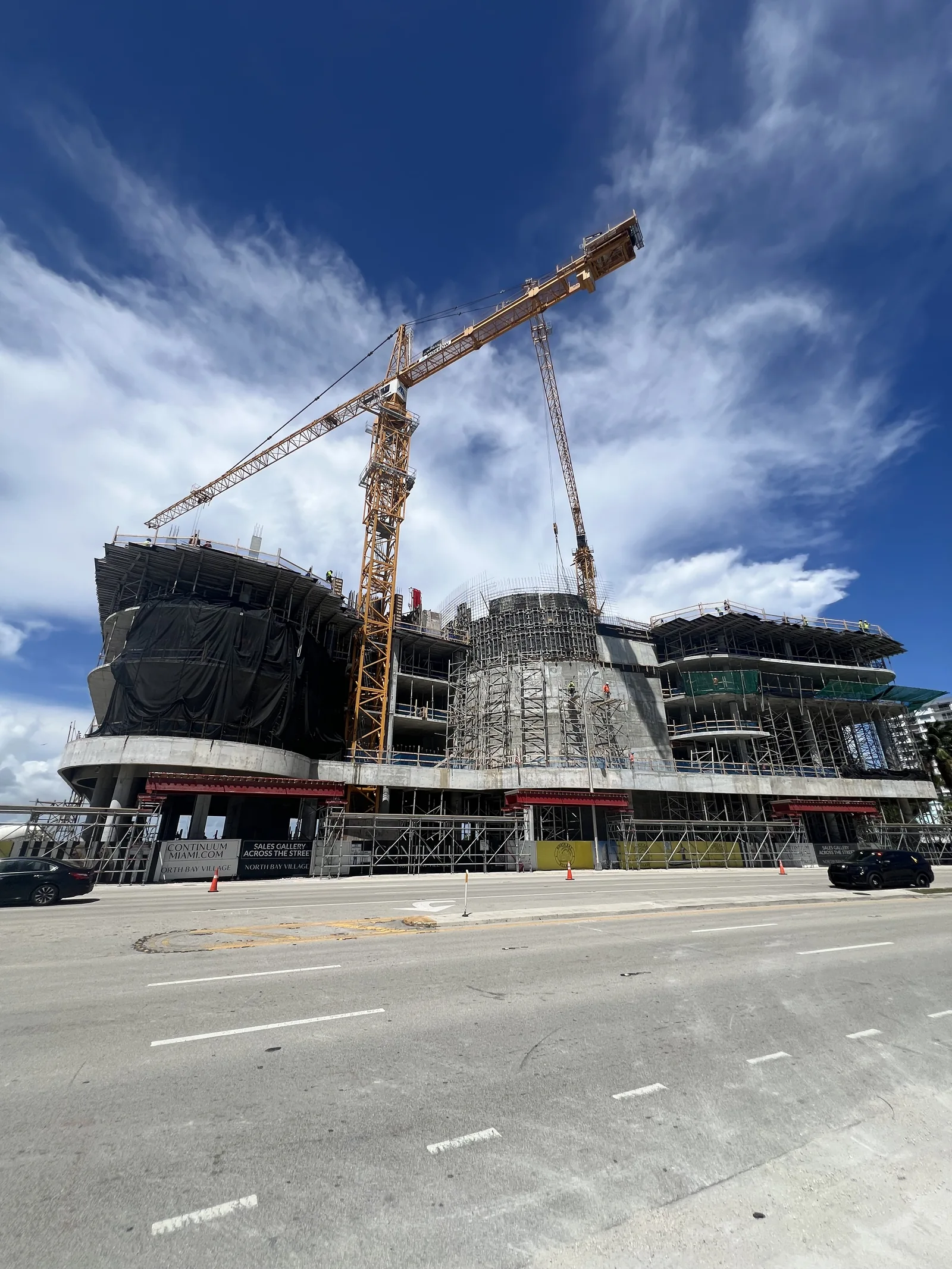 A closer upward view of the crane and exposed concrete at Continuum.