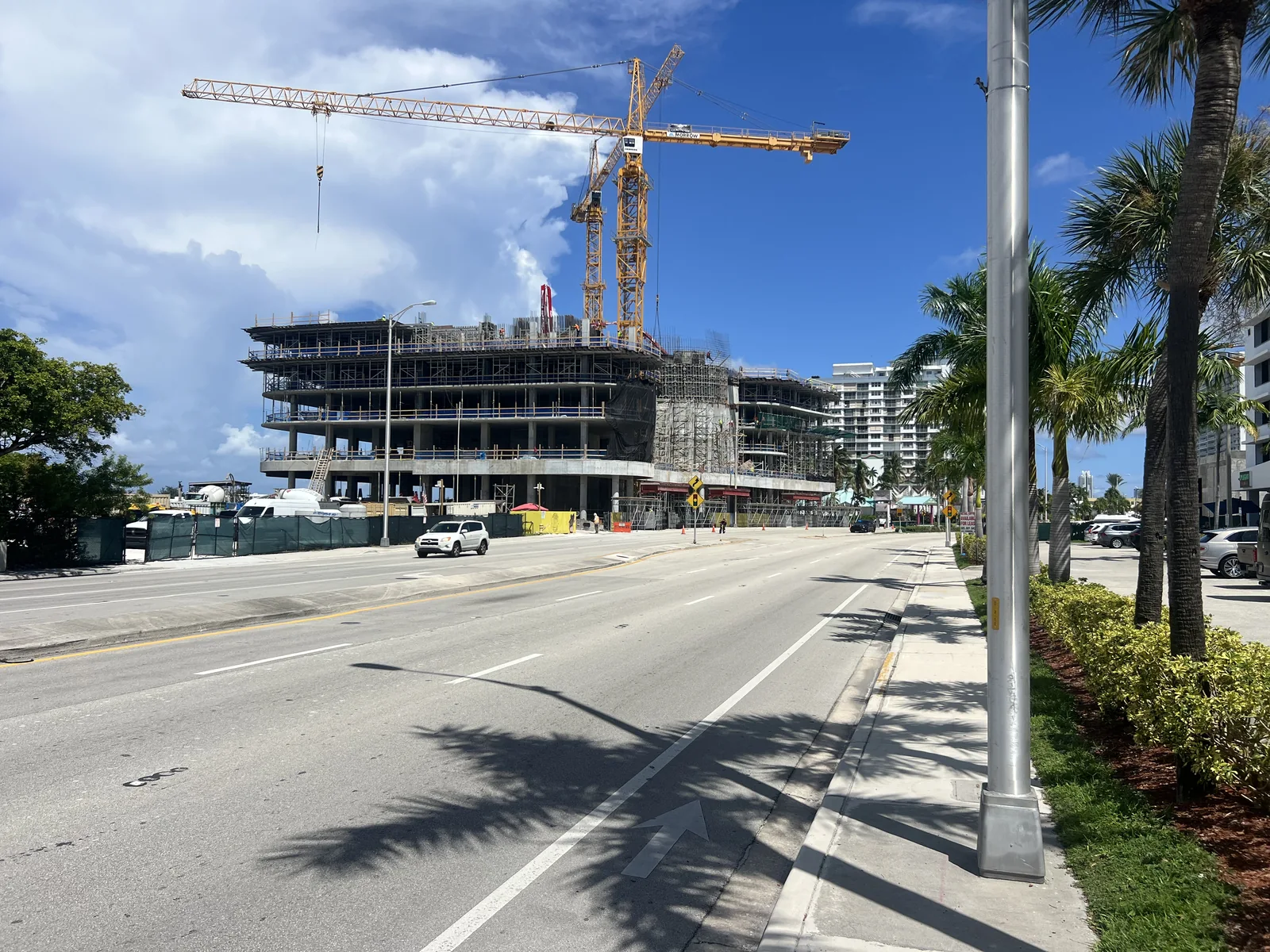 A wider view places the Continuum construction site beside the causeway and pedestrian approach.