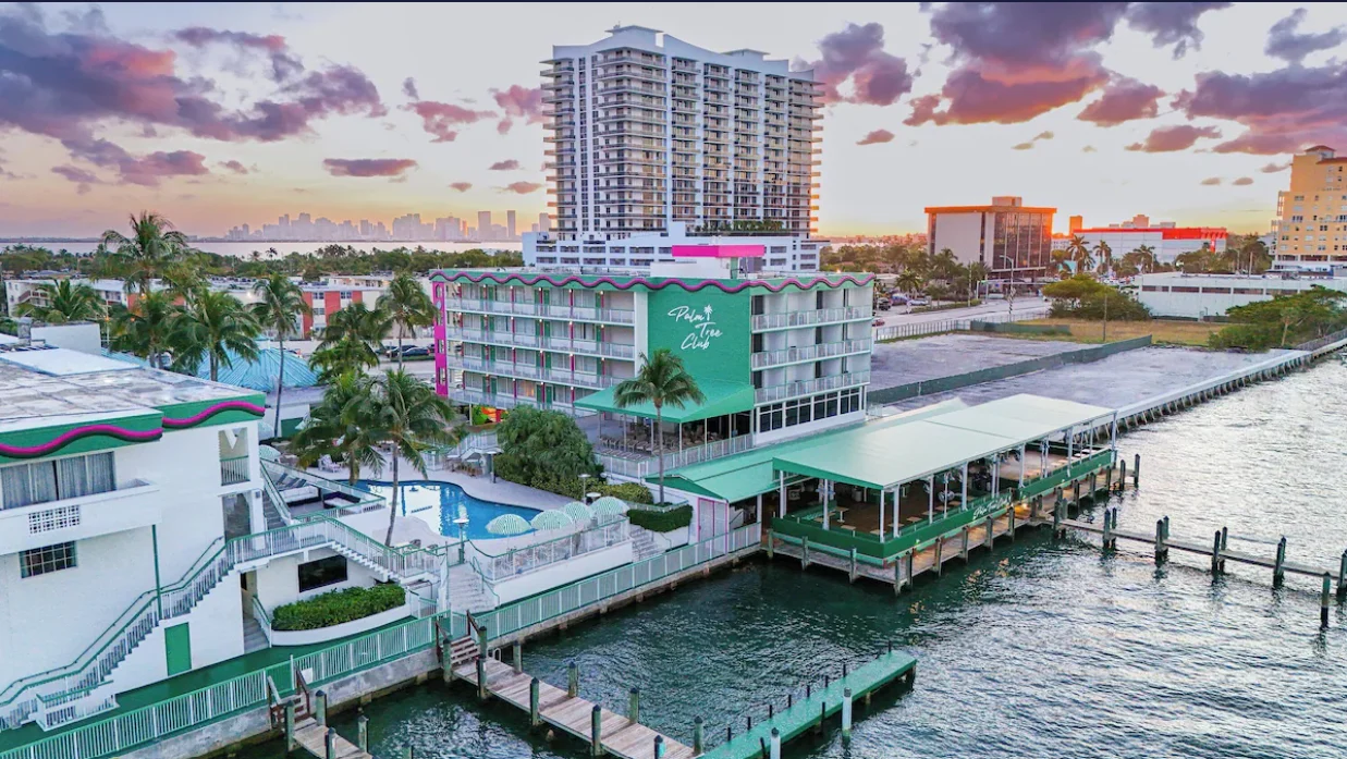 Older aerial view of Palm Tree Club’s hotel, pool, restaurant and waterfront docks