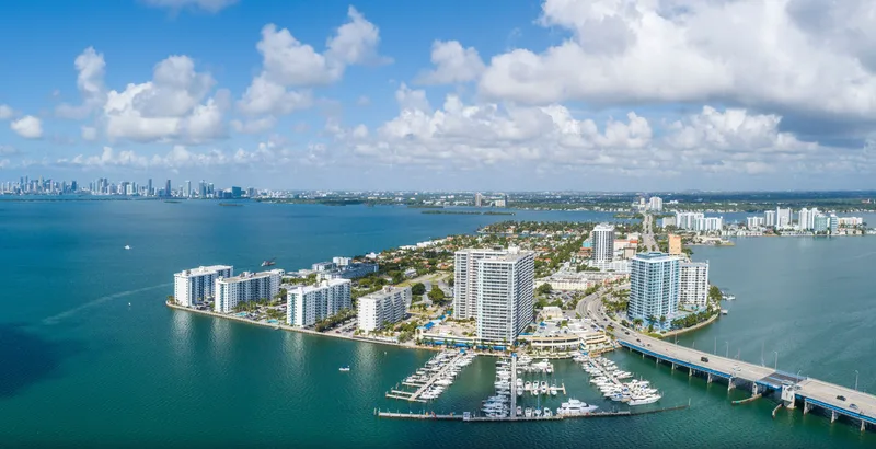 Aerial view of Treasure Island, its waterfront buildings, marina and causeway