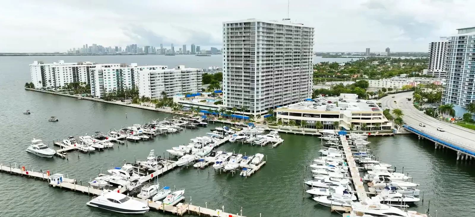 Elevated view of the marina on Treasure Island, with boats, docks and waterfront buildings beside Biscayne Bay
