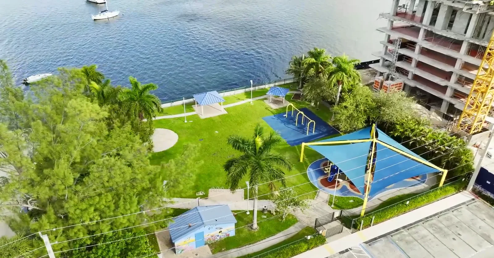 Elevated view of Vogel Park on Harbor Island, with its shaded playground, lawn and Biscayne Bay waterfront